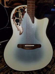 1986 Ovation Adamas II   1581-7 Beige, with bass side only sound holes and case.